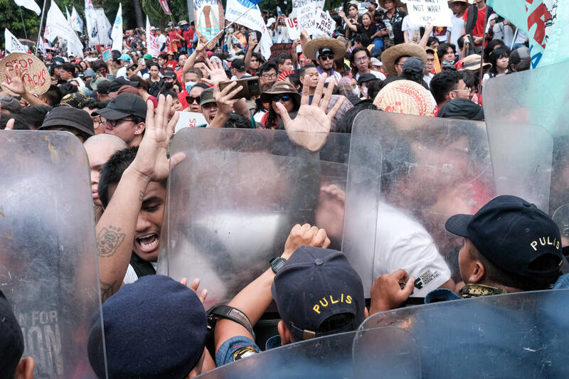 On May 1, 2024, amidst the Labor Day celebrations, workers and progressive organizations confront the anti-riot police force as they march towards the United States Embassy along Roxas Boulevard, Manila City, Philippines. Their demands to the government include better wages, the removal of American troops from the Philippines, and a call for the American government to address the Israel-Palestine conflict.