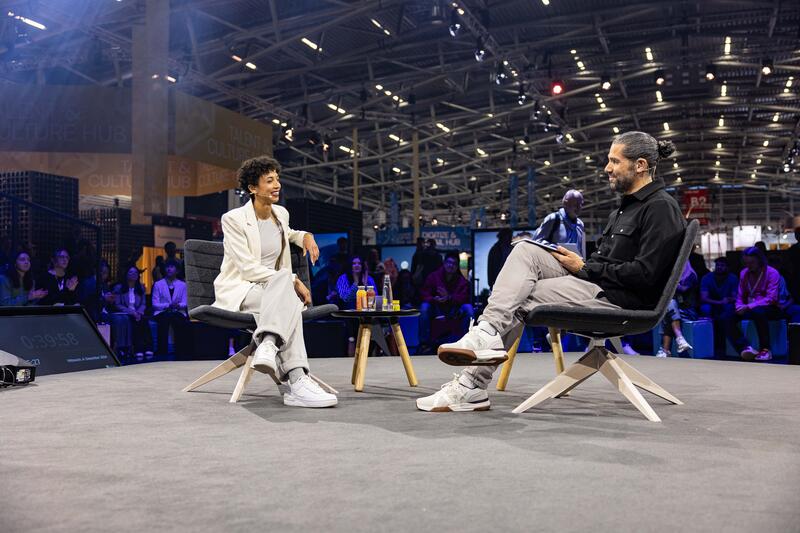 Olympiasiegerin Malaika Mihambo wird am 4.12.2024 auf der ISPO, einer Fachmesse und Business-Festival für die Sport-, Lifestyle-, Health- und Techindustrie, in München von Daniel Herzog interviewt. -- Olympic Gold Medalist Malaika Mihambo getting interviewed by Daniel Herzog at the ISPO, a trade fair and business festival fot the sports, lifestyle and tech industry, on Decmeber 4, 2024 in Munich, Germany