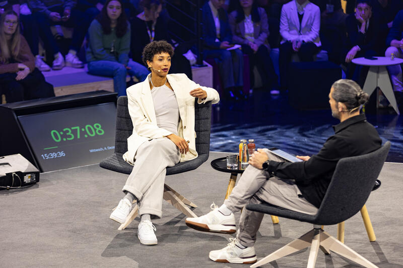 Olympiasiegerin Malaika Mihambo wird am 4.12.2024 auf der ISPO, einer Fachmesse und Business-Festival für die Sport-, Lifestyle-, Health- und Techindustrie, in München von Daniel Herzog interviewt. -- Olympic Gold Medalist Malaika Mihambo getting interviewed by Daniel Herzog at the ISPO, a trade fair and business festival fot the sports, lifestyle and tech industry, on Decmeber 4, 2024 in Munich, Germany