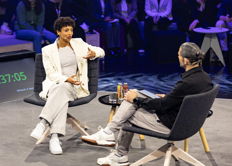 Olympiasiegerin Malaika Mihambo wird am 4.12.2024 auf der ISPO, einer Fachmesse und Business-Festival für die Sport-, Lifestyle-, Health- und Techindustrie, in München von Daniel Herzog interviewt. -- Olympic Gold Medalist Malaika Mihambo getting interviewed by Daniel Herzog at the ISPO, a trade fair and business festival fot the sports, lifestyle and tech industry, on Decmeber 4, 2024 in Munich, Germany