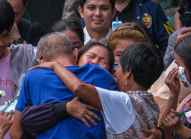 Overseas Filipino Worker Mary Jane Veloso was repatriated to the Philippines from Indonesia on December 18, 2024, after nearly 15 years of detention for allegedly committing drug trafficking and being sentenced to death by firing squad. Upon arrival at Ninoy Aquino International Airport, she was transferred to the Correctional Institution for Women in Mandaluyong City, Philippines, where she was greeted by her family and loved ones. She will remain at the facility while awaiting a decision from President Ferdinand Marcos Jr. regarding the appeal for clemency made by her counsel and family members. Mary Jane Veloso (in black) with her family members.
