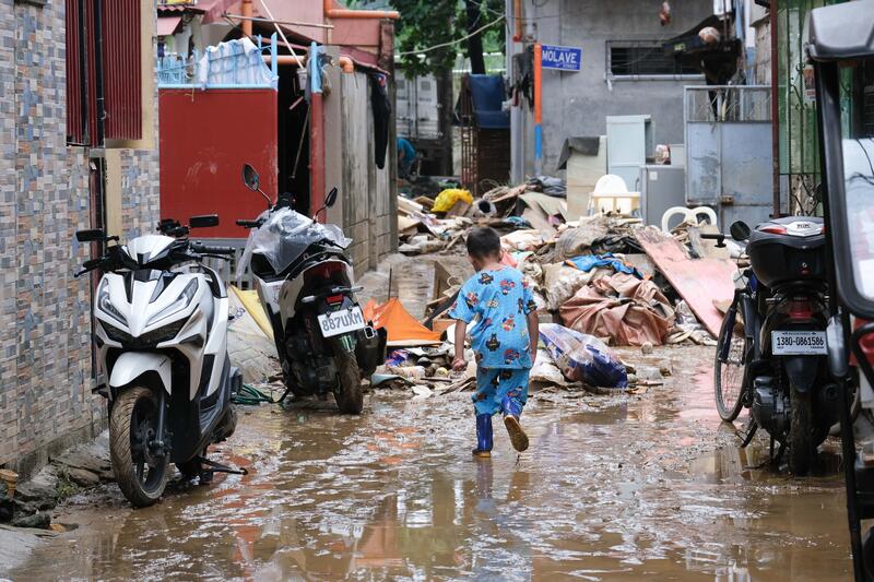 On July 25, 2024, residents of Marikina, Philippines, clean their homes, salvage products and personal belongings ruin by dirt and mud after heavy rain and flooding from Typhoon Gaema, locally named Carina.