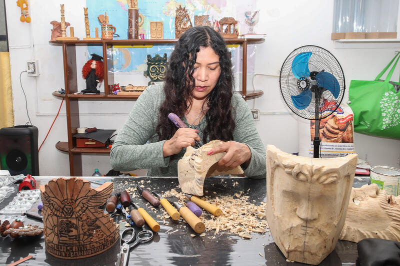 Artisan Elsa Padilla carving a wooden mask during the production of carnival masks, which takes four months to complete. Elsa Padilla has been dedicated to this craft for more than 30 years. on July 22, 2025 in Tizatlan, Mexico.