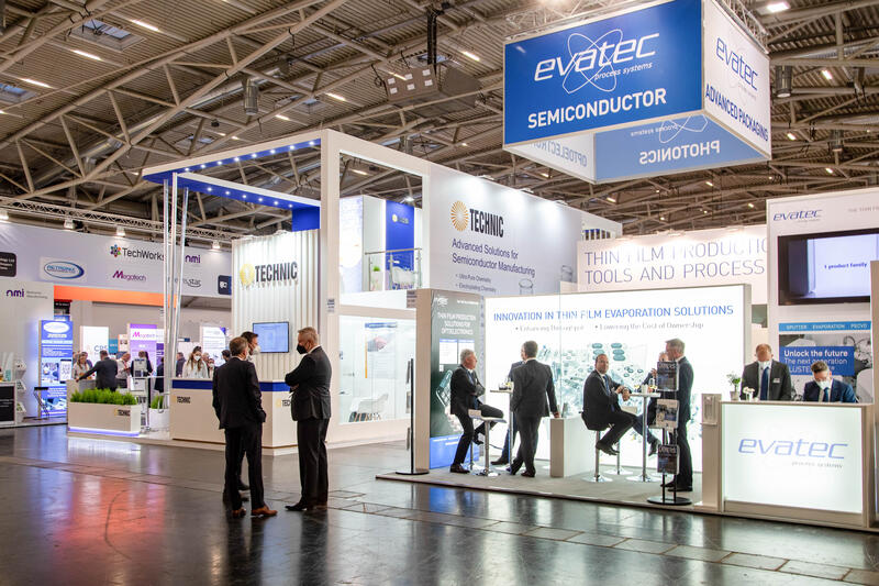 Evatec bei der Productronica Semicon Europe Messe 2021 am 18.11.2021 in München. DIe Productronica ist eine größten Fachmessen der Elektronikindustrie und Halbleiterindustrie. - Evatec  at the Productronica Semocon Europe  trade fair on November 18, 2021 in Munich, Germany. The Productronica is one of the largest trade fairs of electronics and semiconductor industry.